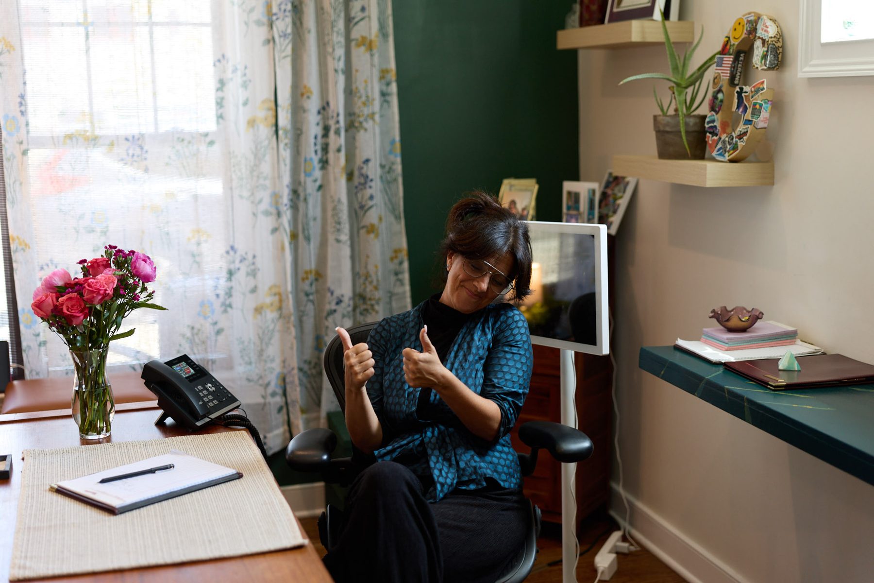 Attorney Tara J. Galbo working at the window desk of the Milford, Connecticut office