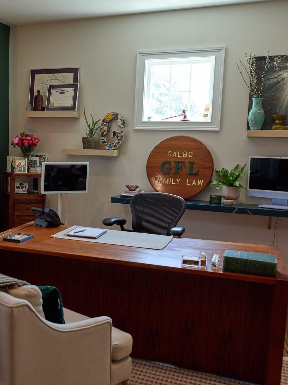 The office of Galbo Family Law at 88 High Street in Milford, Connecticut. Attorney Galbo's desk beneath the carved GFL Family Law seal